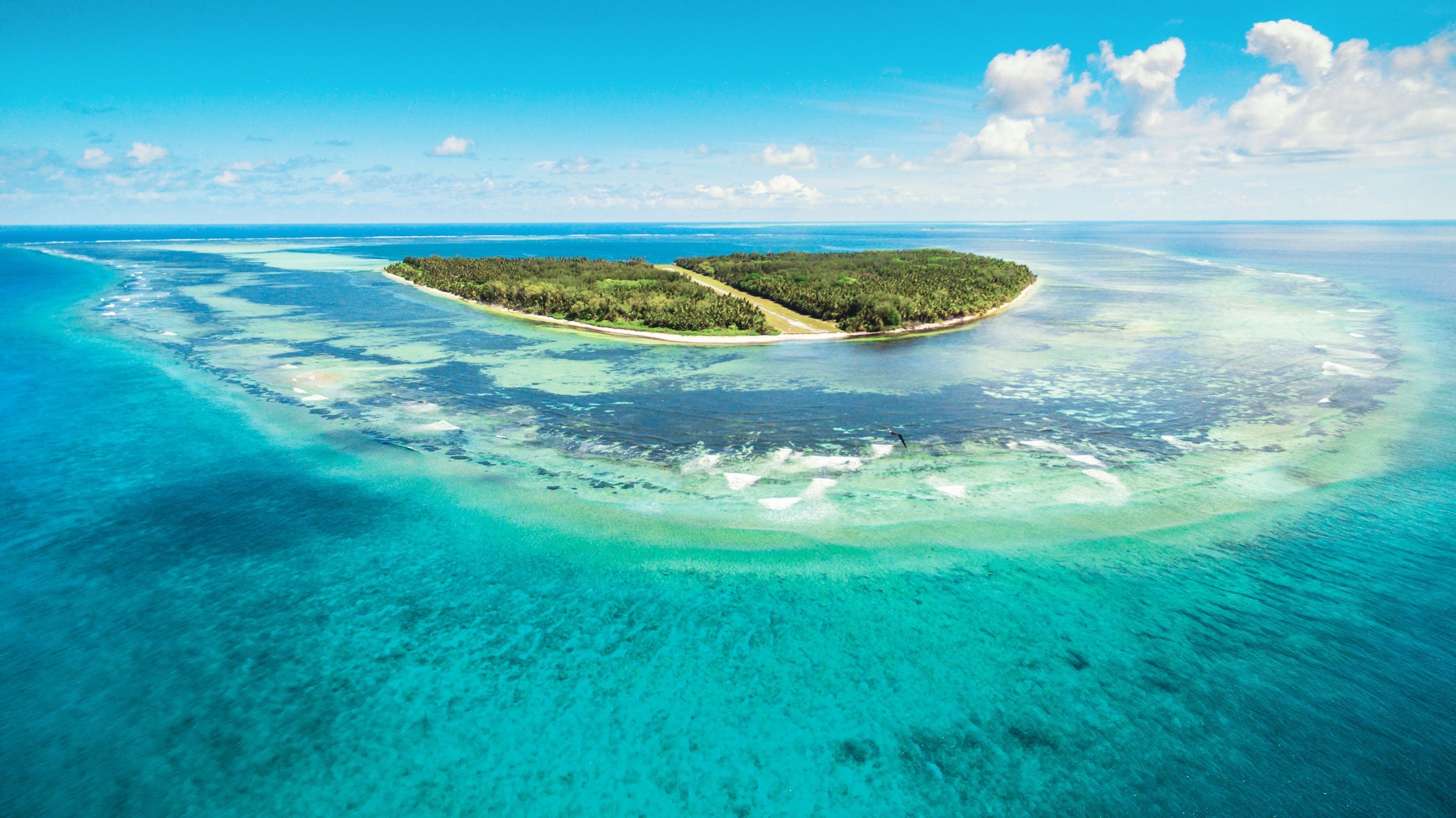Alphonse Island in the Seychelles from the air, reef flats all around it